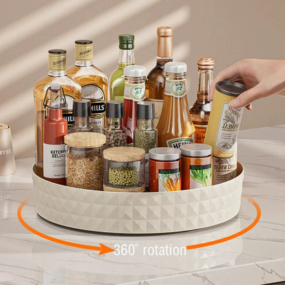 360-degree rotating lazy susan kitchen organizer full of spices, condiments and pantry bottles on countertop