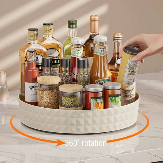 360-degree rotating lazy susan kitchen organizer full of spices, condiments and pantry bottles on countertop