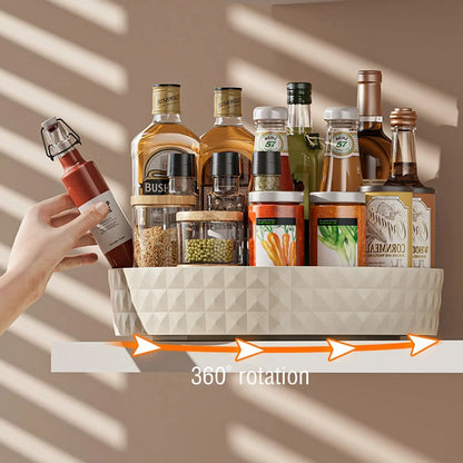 Cream white rotating lazy susan spice rack with 360-degree rotation arrows, hand reaching for condiment bottle