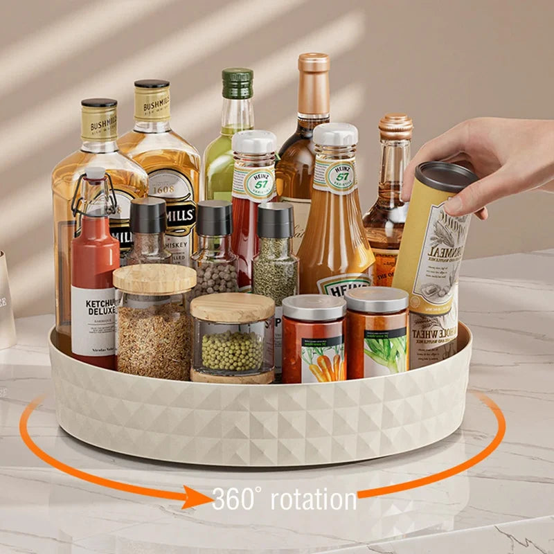 Cream white rotating lazy susan pantry organizer with condiments and spice bottles, hand picking up item with 360 rotation